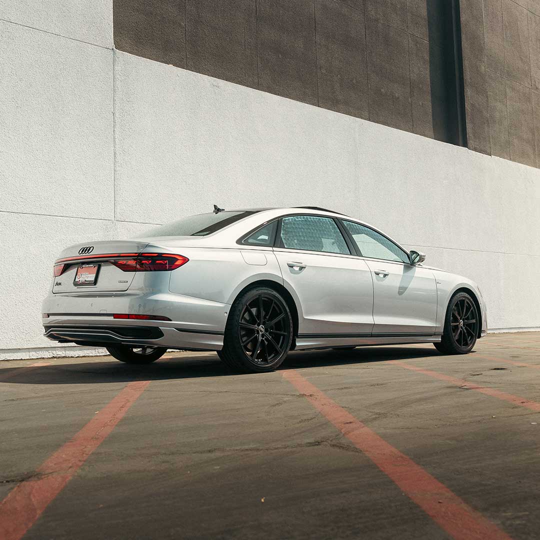 silver audi a8 sedan parked against concrete wall car leasing guide